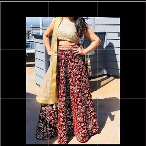 Lehenga- maroon and gold lehenga.
